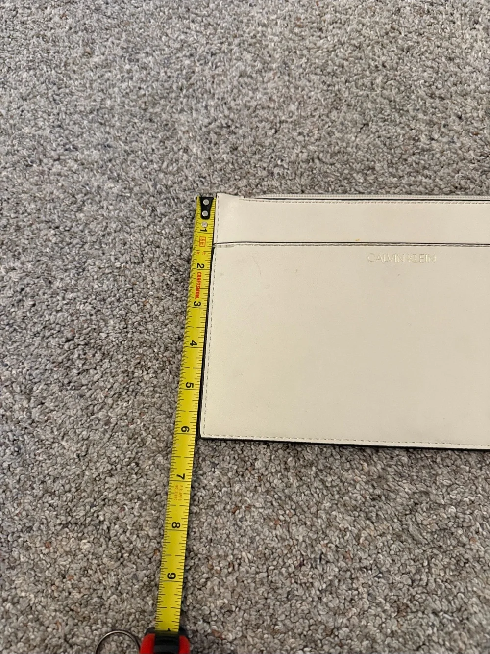 Calvin Klein Ivory Wristlet with Gold Hardware